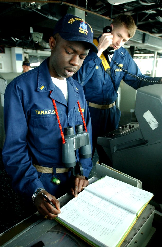 US Navy 030319-N-6141B-002 U.S. Navy Ensign Patrick Tamakloe from Gaithesburg, Md., and Lt.j.g. Jonathan Keffer from Wilmington, N.C., record and establish contact with a nearby merchant vessel