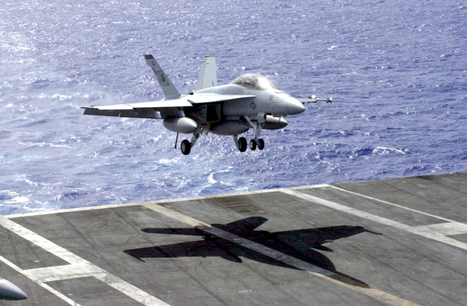 US Navy 030322-N-2143T-003 An F-A-18F Super Hornet prepares to make an arrested landing