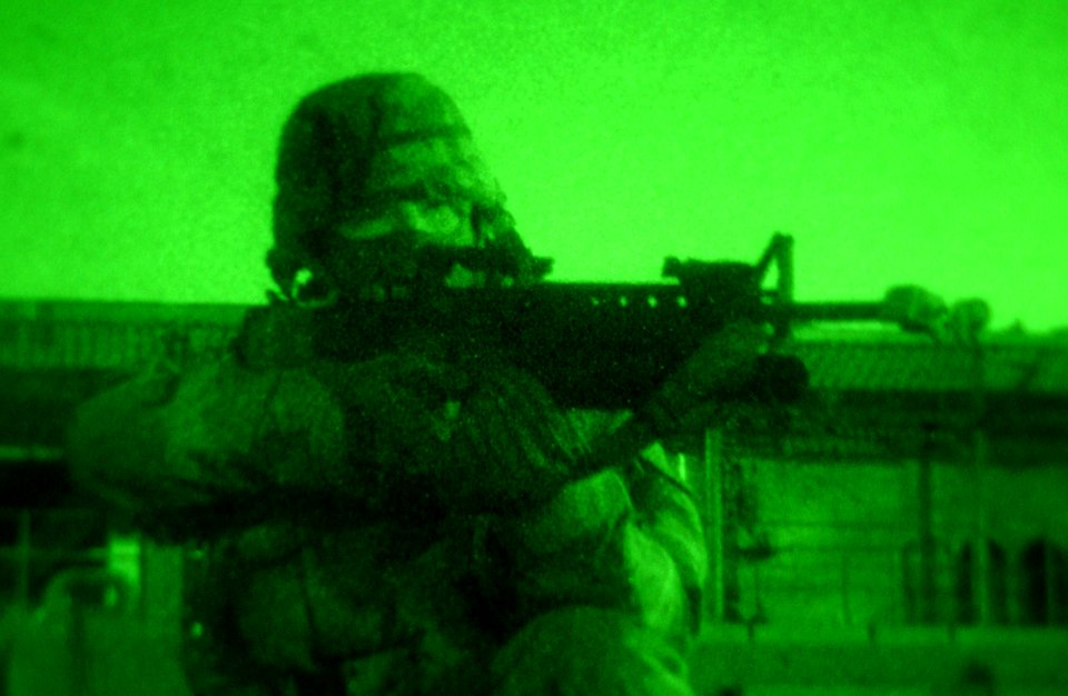 US Navy 030310-F-9208L-007 Gunner's Mate 3rd Class Gary Rocke from Ione, Calif., defends the amphibious dock landing ship USS Mount Vernon (LSD 39) while docked pier side during Exercise Northern Edge 2003