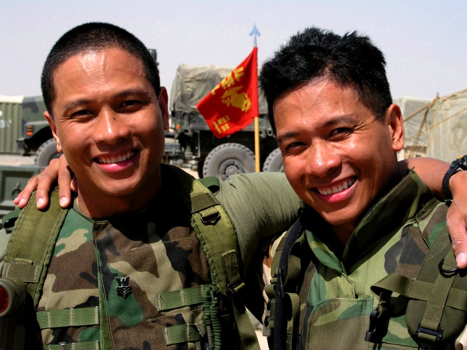 US Navy 030319-N-0728B-001 Twin brothers, Roseller Flores and Alexis Flores (right) both U.S. Navy 1st Class Hospital Corpsman deployed with forces supporting Operation Enduring Freedom