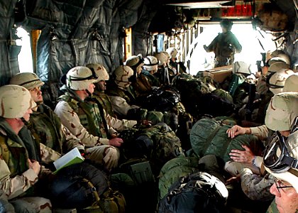 US Navy 030215-N-4048T-042 U.S. Marines load onto a CH-46 Helicopter