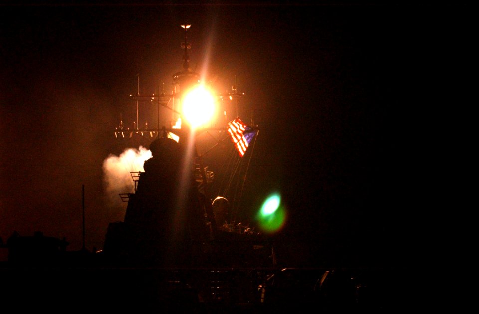 US Navy 030320-N-6141B-001 The Arleigh Burke class guided missile destroyer USS Donald Cook (DDG 75) launches three of its Tomahawk Land Attack Missiles (TLAM) at military targets in Iraq