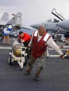 US Navy 030321-N-0382O-504 Aviation Ordnancemen assigned to 'The Swordsmen' of Fighter Squadron Thirty Two (VF-32)