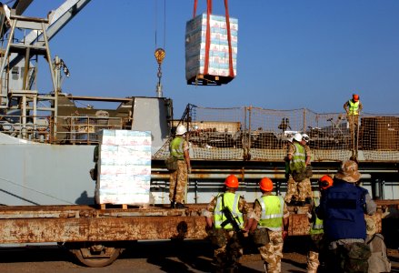 US Navy 030328-N-2513W-054 Bottled water is delivered by crane to the port of Umm Qasr photo