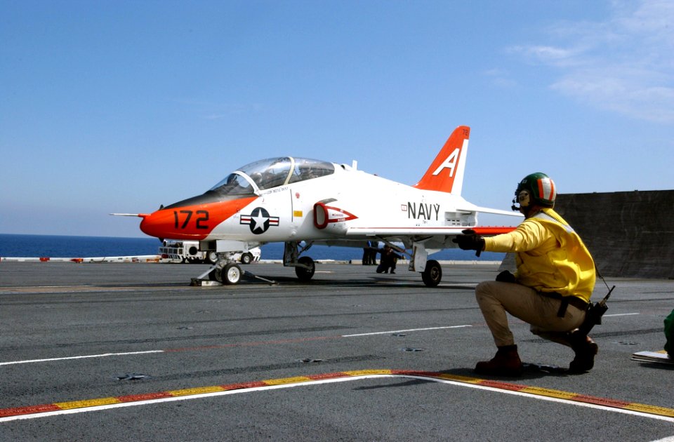 US Navy 030314-N-4768W-051 A T-45C Goshawk receives the launch signal from a shooter on the flight deck of USS John C. Stennis (CVN 74)
