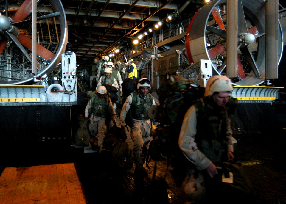 US Navy 030217-N-2972R-007 In the well deck aboard the amphibious assault ship USS Kearsarge (LHD 3), Marines assigned to the 2d Marine Expeditionary Brigade (2d MEB) embark Assault Craft Unit 4 (ACU-4) Hopper 68