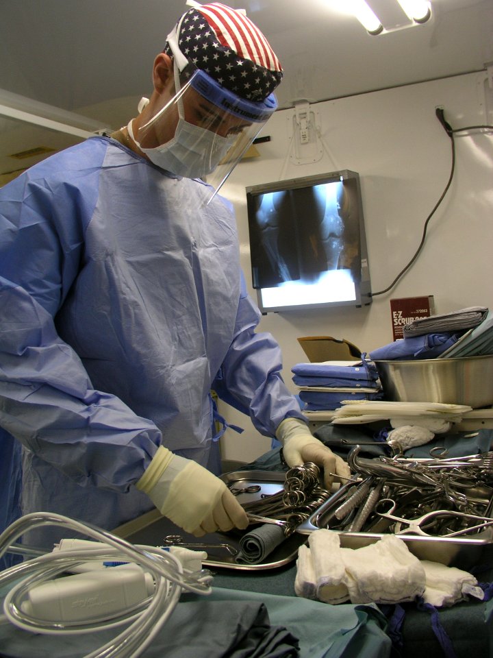US Navy 030401-N-0728B-056 Hospital Corpsman 3rd Class Patrick Agan from Columbus, Ohio, prepares instruments for surgery just hours after the completion of construction of Fleet Hospital Three (FH-3)