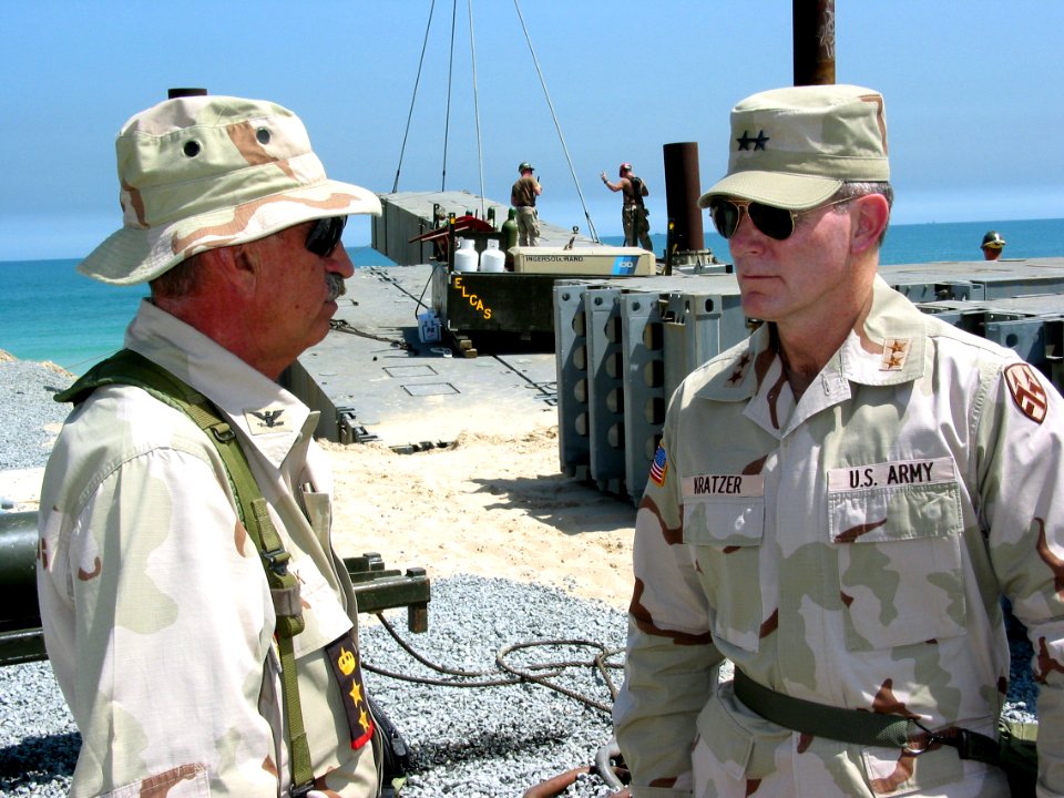 US Navy 030402-N-1050K-032 Capt. Donald P. Cook, Commander, Camp Patriot, describes the process and function of the Elevated Causeway System (ELCAS) modular structure to Maj. Gen. David Kratzer, Commanding General, 377th Theate