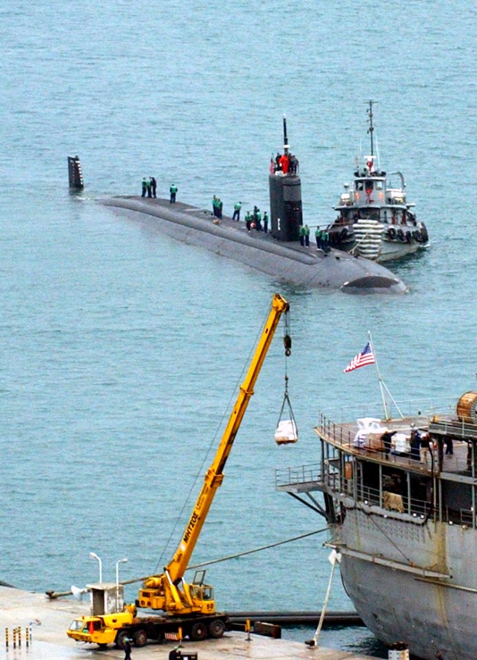 US Navy 030221-N-0780F-017 Los Angeles class submarine USS San Juan (SSN 751) arrives for a port visit and prepares to be berthed next to submarine tender USS Emory S. Land