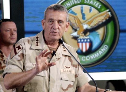 US Navy 030322-N-5891B-030 U.S. Army Gen. Tommy R. Franks, Commander in Chief of U.S. Central Command, holds a press conference with embedded media in the media center in the Quatar