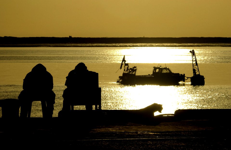 US Navy 030328-N-3783H-152 Members of Commander Task Unit (CTU-55.4.3) watch the sunrise at the port of Umm Qasr, Iraq
