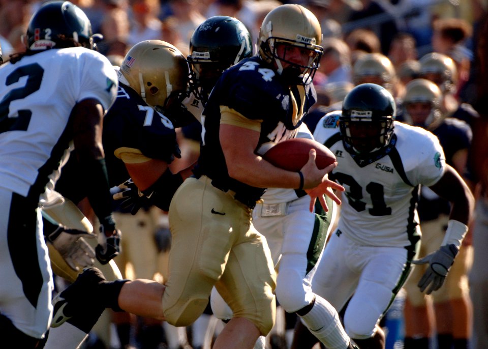 US Navy 051105-N-9693M-005 U.S. Naval Academy Midshipman 2nd Class Matt Hall (34) carries the ball against the Tulane Green Wave defense