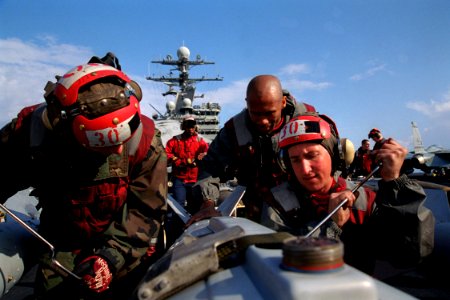 US Navy 030321-N-9964S-027 Aviation Ordnancemen inspect a Joint Direct Attack Munition (JDAM) GBU-31 in preparation for loading on air wing aircraft on the flight deck aboard the aircraft carrier USS Harry S. Truman (CVN 75)