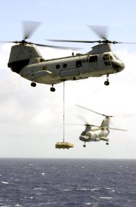 US Navy 030324-N-6536T-001 CH-46 Sea Knight helicopters assigned to the Gunbearers of Helicopter Combat Support Squadron One One (HC-11)