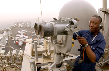 US Navy 030326-N-1810F-014 The forward look out maintains his post on the signal bridge aboard the aircraft carrier USS Kitty Hawk (CV 63)