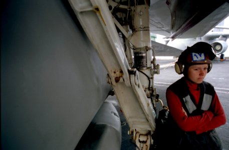 US Navy 030321-N-9964S-041 An Aviation Ordnancemen on the flight deck aboard the aircraft carrier USS Harry S. Truman (CVN 75) awaits the start of the next flight operation