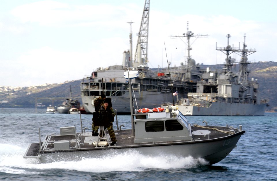 US Navy 030303-G-3024G-003 A 27-foot patrol boat assigned to U.S . Naval Coastal Warfare Group Two watches over vessels in the anchorage area in Souda Bay