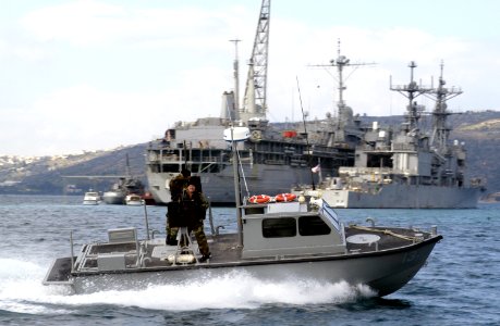 US Navy 030303-G-3024G-003 A 27-foot patrol boat assigned to U.S . Naval Coastal Warfare Group Two watches over vessels in the anchorage area in Souda Bay