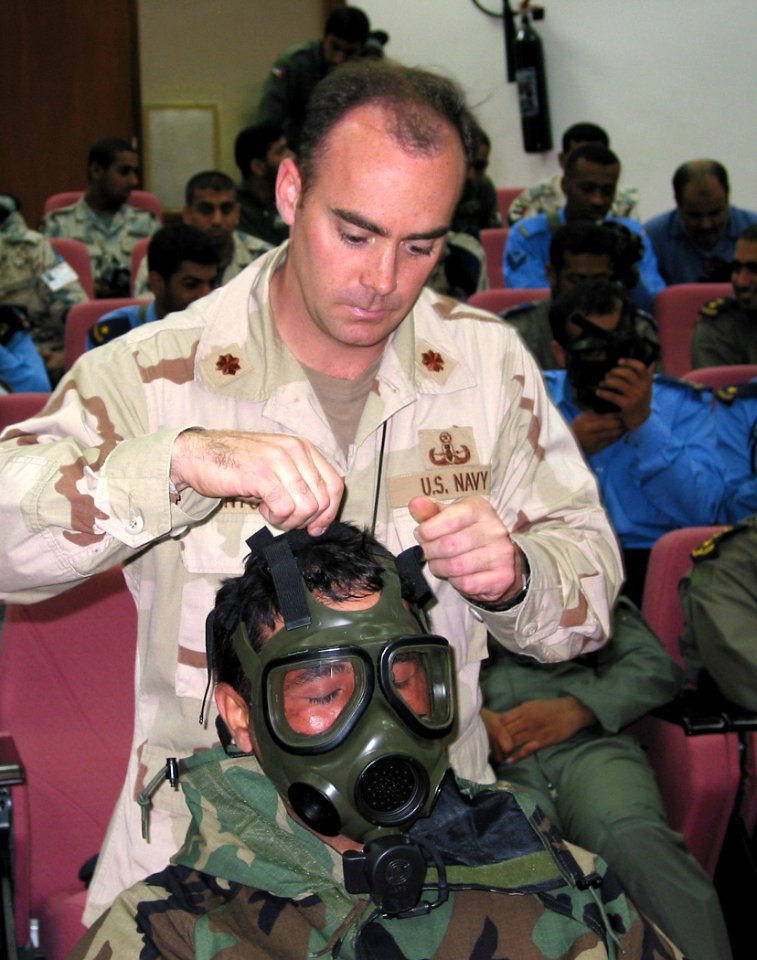 US Navy 030305-N-1050K-006 Lt. Cmdr. Edan Antoine, Camp Patriot coordinator for chemical, biological and radiological (CBR) training and supplies, instructs an United Arab Emirates (UAE) Airman