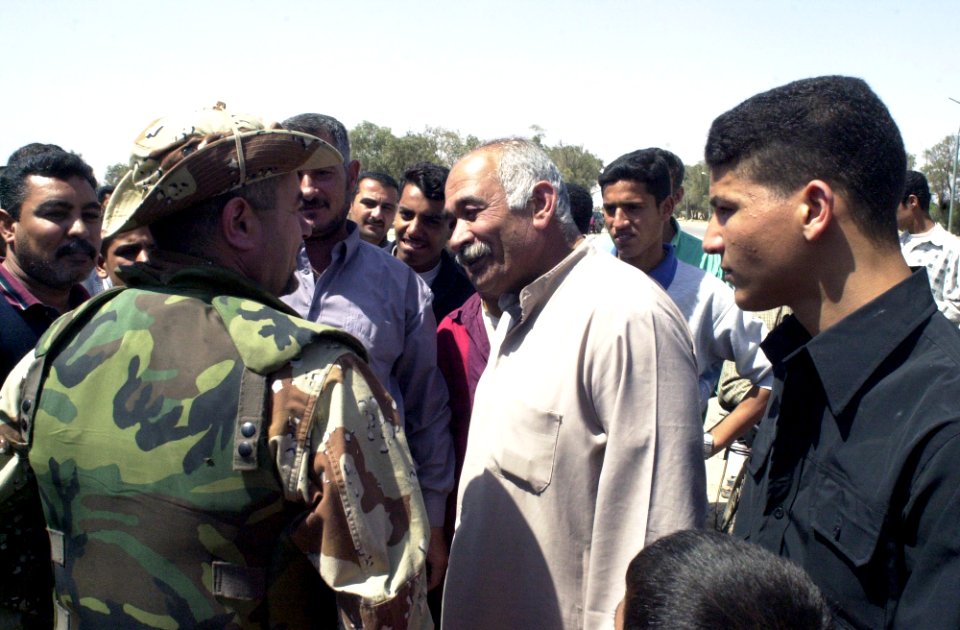 US Navy 030328-A-2018L-009 A member of the Free Iraqi Forces (FIF) is reunited with family members in his home village. Free Iraqi Forces are Shiia and Sunni Muslims, Arabs and Kurds, all exiled from Iraq who are committed to