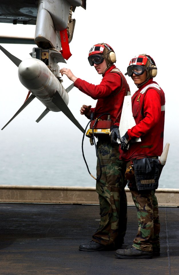 US Navy 030327-N-1810F-013 Aviation ordnancemen apply fins to a high-speed anti-radiation missile (HARM) located on an EA-6B Prowler