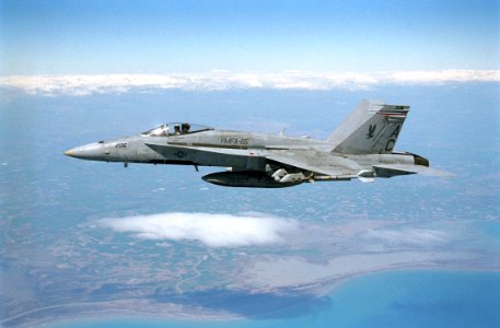 US Navy 030327-N-0000X-002 An F-A-18 Hornet assigned to the Silver Eagles of Marine Fighter Attack Squadron One One Five (VMFA-115) flies a combat mission over Iraq