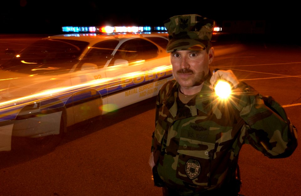 US Navy 030404-N-5862D-043 Master-at-Arms 1st Class Chris Pace from Sanford, N.C., is a key member of the Naval Support Activity (NSA) Mid-South Police Force. He and his shipmates are the first line of defense aboard the small