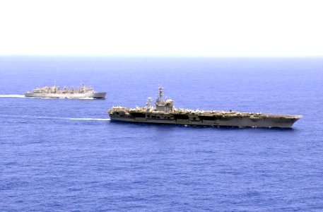 US Navy 030321-N-6536T-001 The U.S. Navy nuclear powered aircraft carrier USS Nimitz (CVN 68) and the fast combat support ship USS Bridge (AOE 10) underway while in the Pacific Ocean