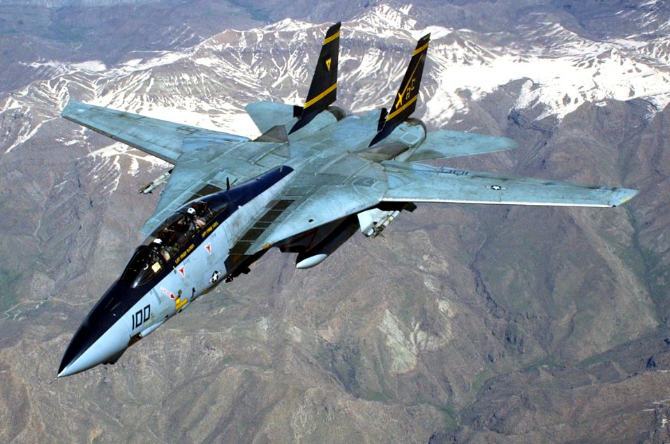 US Navy 030411-N-0780F-053 An F-14 Tomcat embarked aboard USS Harry S. Truman (CVN 75) flies a combat mission in direct support of Operation Iraqi Freedom