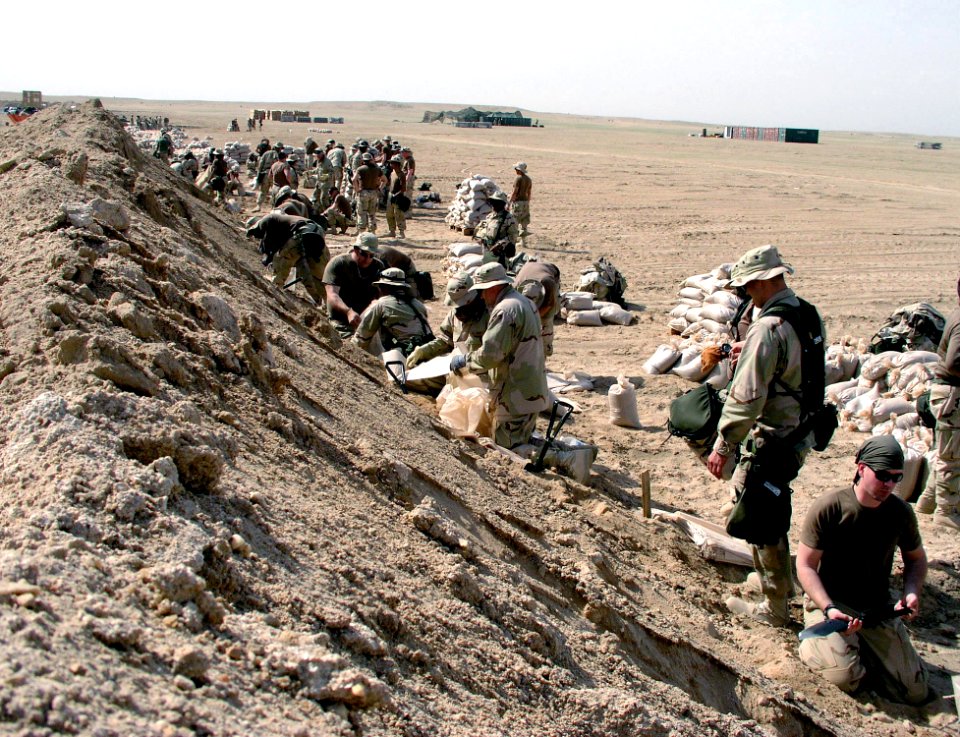US Navy 030312-N-0728B-003 Members of Fleet Hospital Three prepare sand bags to fortify their new compound, shortly after arriving in the Central Command Area of Responsibility