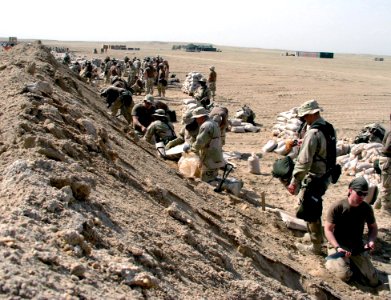 US Navy 030312-N-0728B-003 Members of Fleet Hospital Three prepare sand bags to fortify their new compound, shortly after arriving in the Central Command Area of Responsibility