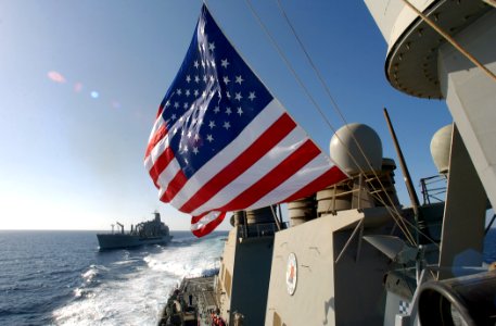 US Navy 030327-N-6141B-016 The Arleigh Burke-class destroyer USS Donald Cook (DDG 75) pulls away from the Military Sealift Command Oiler USNS Kanawha (T-AO 196) after receiving stores and fuel during an underway replenishment (