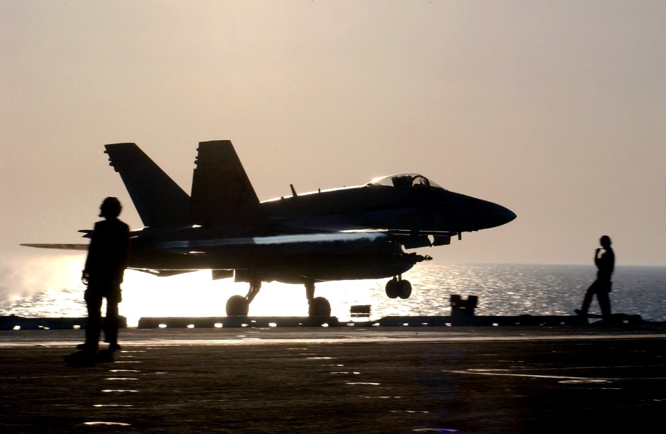 US Navy 030402-N-1810F-009 An F-A-18C Hornet launches from the bow of USS Kitty Hawk (CV 63)