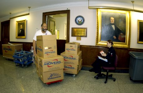 US Navy 031113-N-9693M-004 Danny Brooks pushes boxes out of the office
