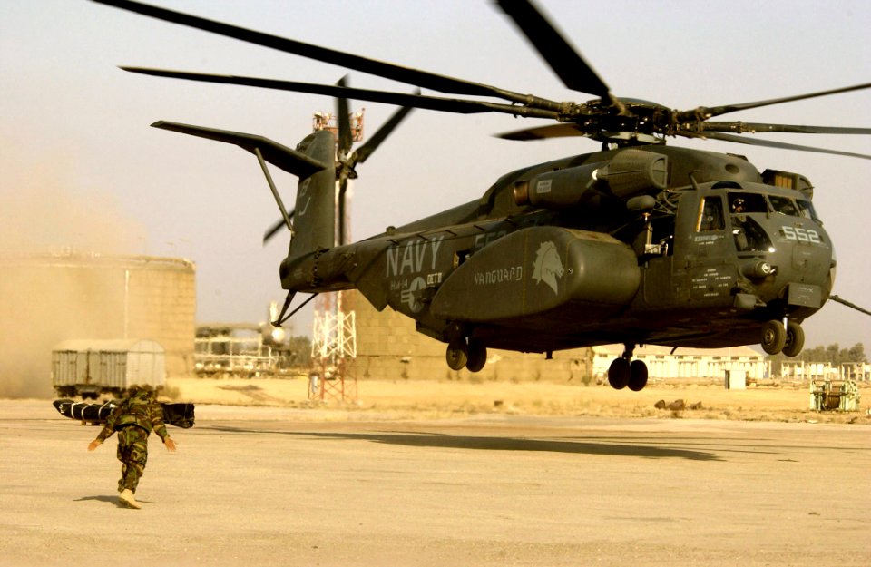 US Navy 030328-N-3783H-191 A member of Commander Task Unit (CTU-55.4.3) directs an MH 53E Sea Dragon helicopter assigned to the Vanguards of Helicopter Mine Countermeasures Squadron Fourteen (HM-14) for launch
