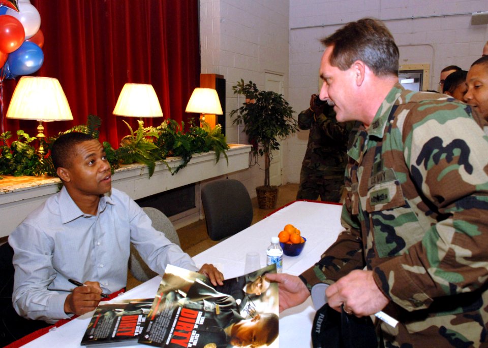 US Navy 060117-N-6996K-002 Actor Cuba Gooding Jr. sign an autograph for Master Chief Master Diver James Mariano