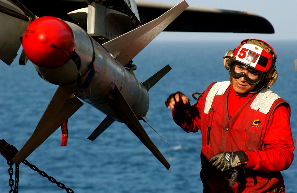 US Navy 030328-N-1810F-024 Airman Francisco Escobedo of VAQ-136 prepares a HARM on an EA-6B Prowler