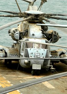 US Navy 030327-N-1512S-011 A CH-53E Super Stallion rests on the flight deck of USS Kearsarge (LHD 5) after going through another sand storm