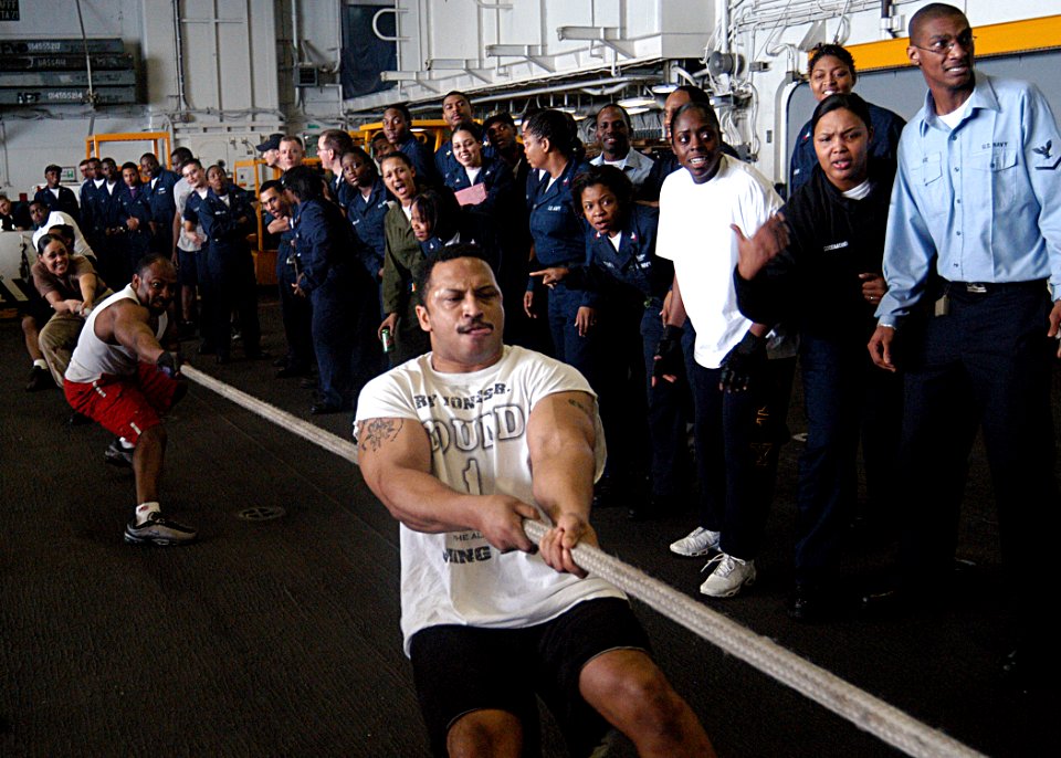 US Navy 030329-N-1512S-008 Yeoman 2nd Class Christopher Chatman from Baton Rouge, La., leads the ship's Administrative Office Tug-of-War team