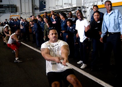 US Navy 030329-N-1512S-008 Yeoman 2nd Class Christopher Chatman from Baton Rouge, La., leads the ship's Administrative Office Tug-of-War team