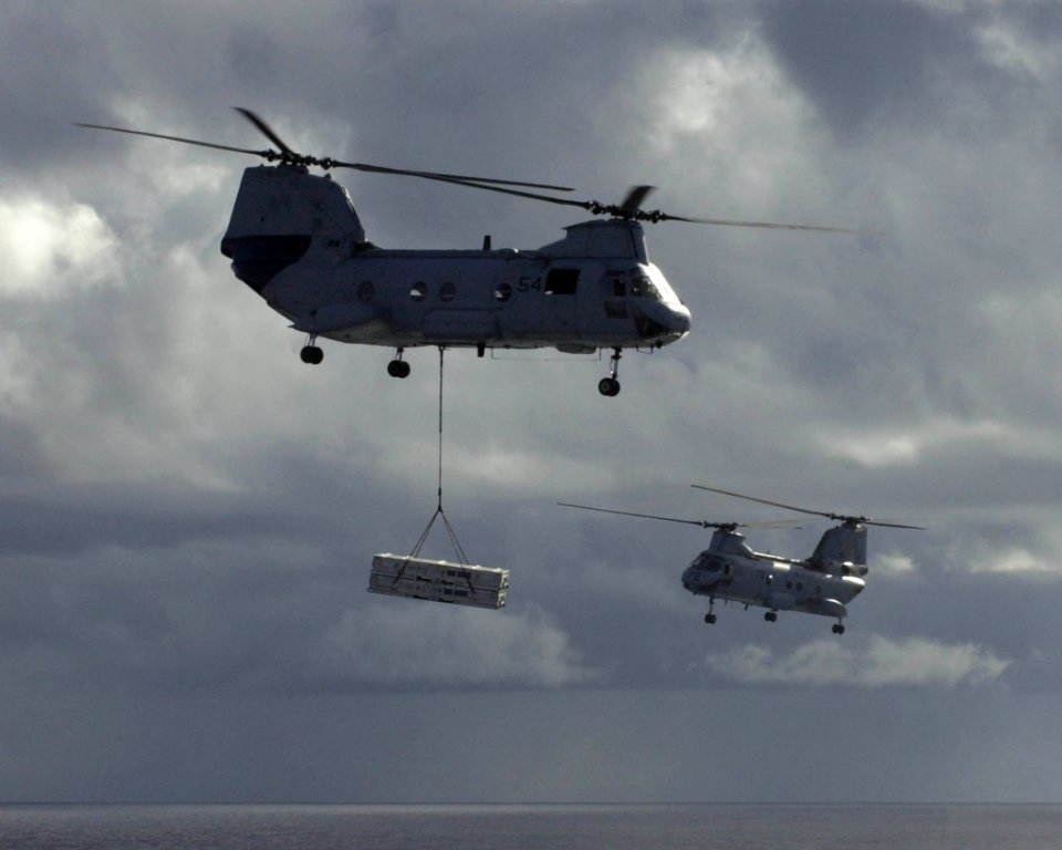 US Navy 030316-N-2143T-009 Two CH-46 Sea Knight helicopters transfer ordnance