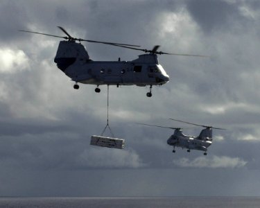 US Navy 030316-N-2143T-009 Two CH-46 Sea Knight helicopters transfer ordnance