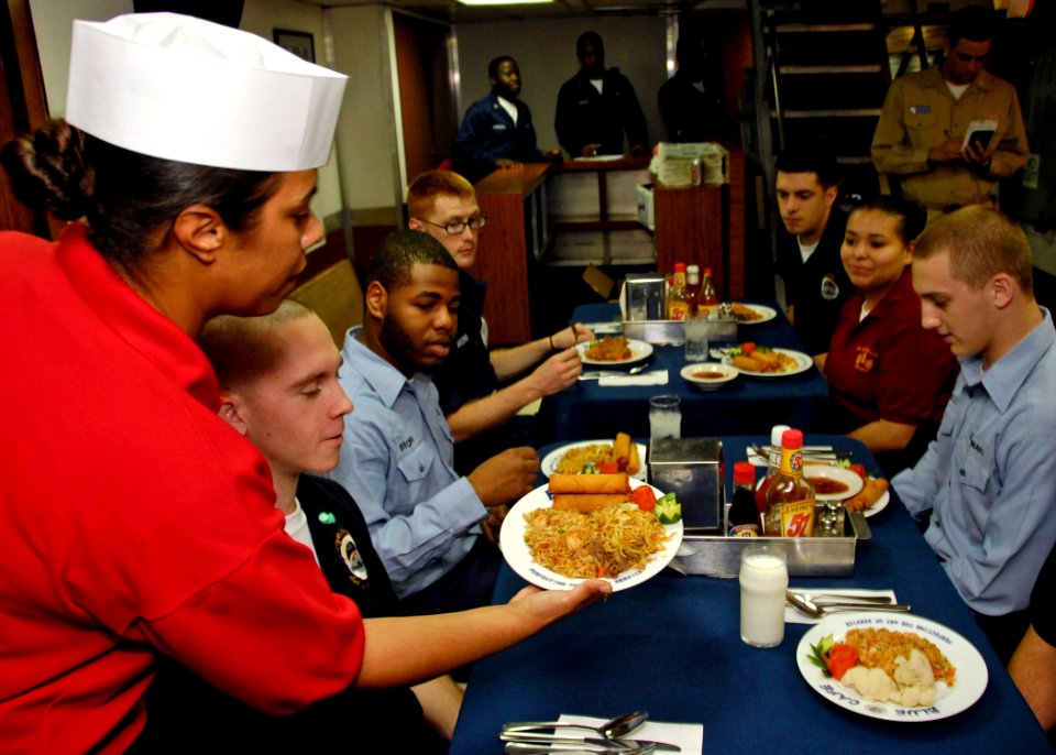 US Navy 080820-N-7280V-019 Yeoman Seaman Kristopher Phay enjoys an Asian-Pacific meal