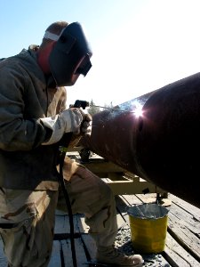 US Navy 030402-N-1050K-037 Steelworker Constructionman Patrick Lewis from Kenosha, Wis., is attached to Amphibious Construction Battalion Two (ACB-2) stationed at Little Creek, Va