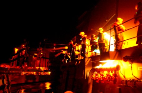 US Navy 030402-N-6141B-004 Deck Department personnel from the USS Donald Cook (DDG 75) receive stores and fuel via a connected replenishment