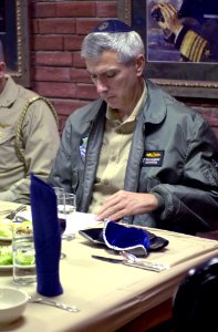 US Navy 030417-N-8273J-004 Rear Adm. Samuel Jones Locklear, Commander Cruiser Destroyer Group Five (CCDG-5), reads from the Passover Hagaddah (prayer book) during a Passover Seder dinner in the wardroom aboard USS Nimitz (CVN 6