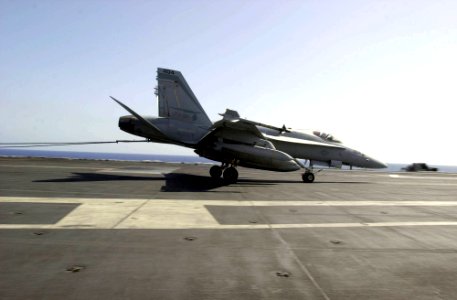 US Navy 030404-N-2385R-002 An F-A-18 Hornet assigned to the Mighty Shrikes of Strike Fighter Squadron Ninety Four (VFA-94) completes an arrested landing