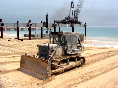 US Navy 030404-N-1050K-010 U.S. Navy Seabees assigned to Amphibious Construction Battalions One and Two continue to smooth the beaches for future operations in preparation for the completion of the at Camp Patriot