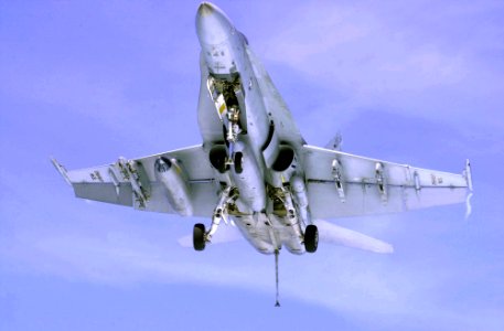 US Navy 030321-N-2143T-003 An F-A-18A Hornet makes a final approach while making an arrested landing aboard the nuclear powered aircraft carrier USS Nimitz