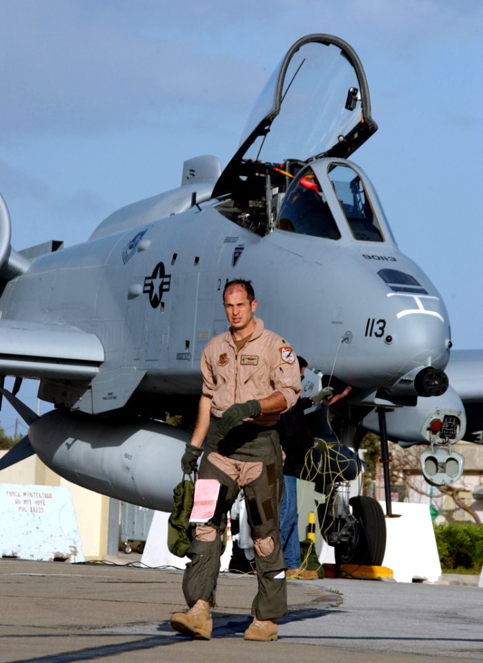 US Navy 030405-N-0780F-013 A U.S. Air Force pilot departs his A-10 Thunderbolt at a stop-over point while transiting to a forward deployed location in support of Operation Iraqi Freedom
